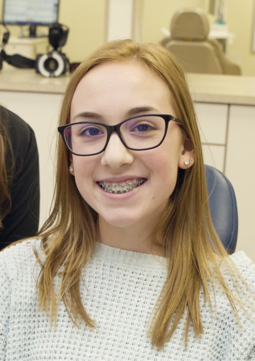 teen patient smiling with braces
