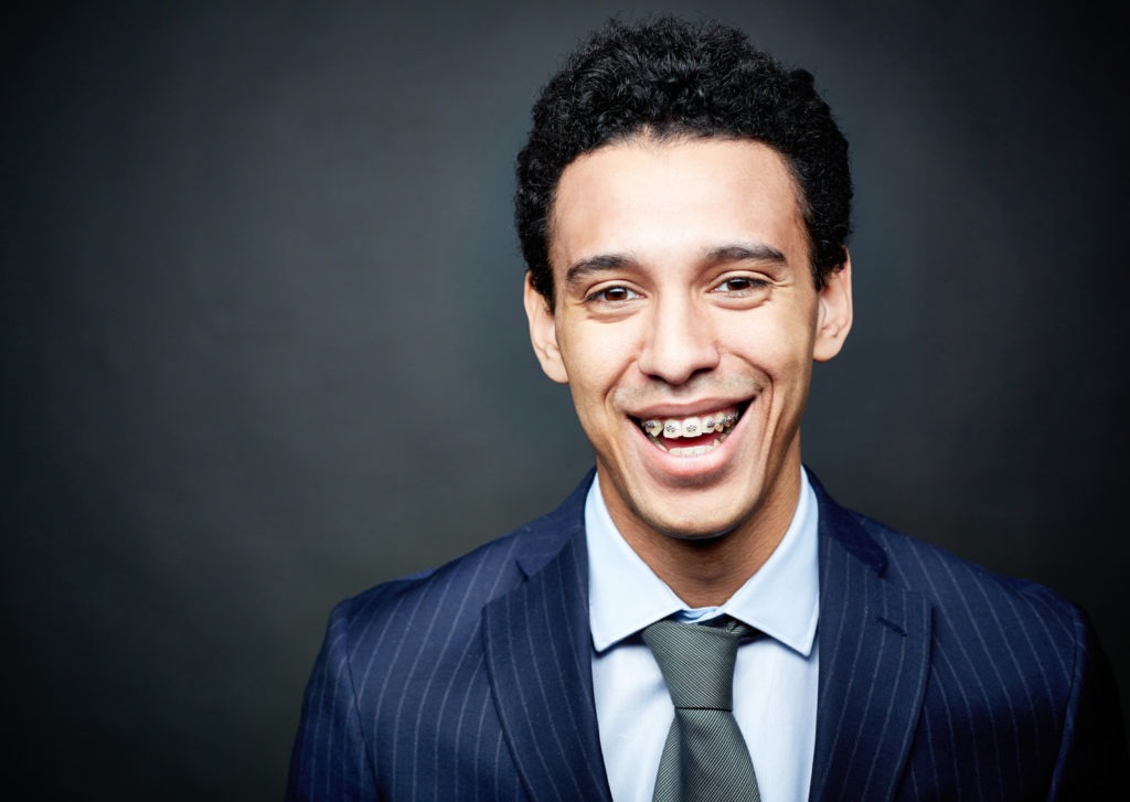 man with braces smiling
