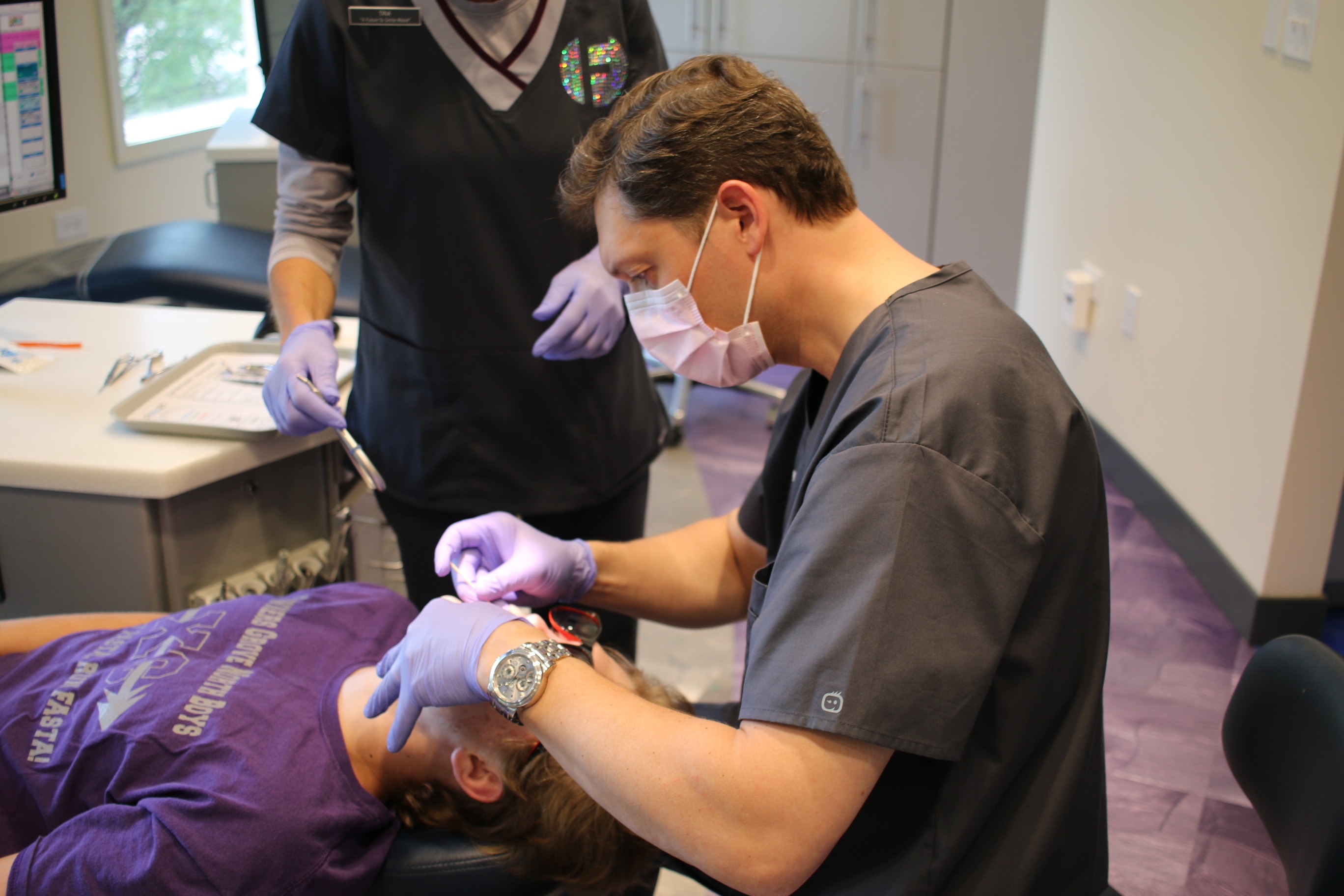 Dr. Frey working with a patient