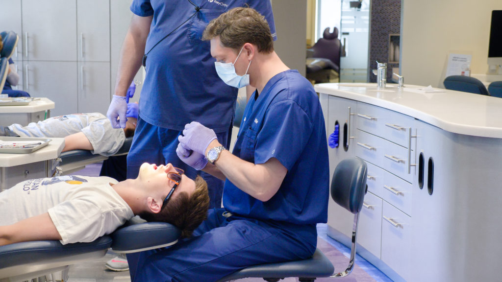 Dr. Frey working with a patient