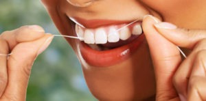 Flossing teeth