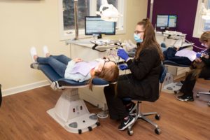 Frey assistant working on a patient's teeth