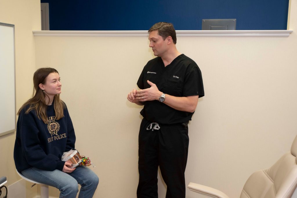 Dr. Frey talking to teen patient