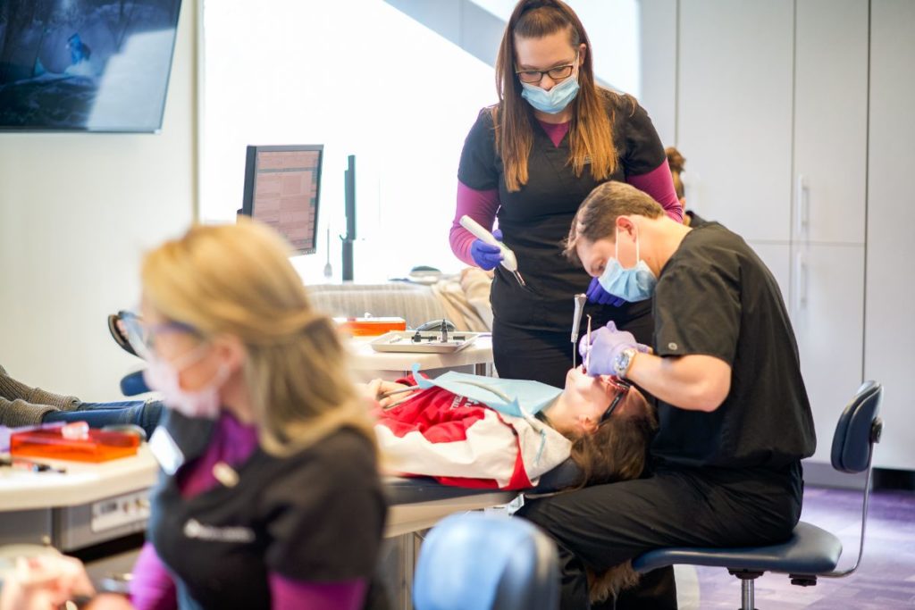 Dr. Frey working on a patient's teeth